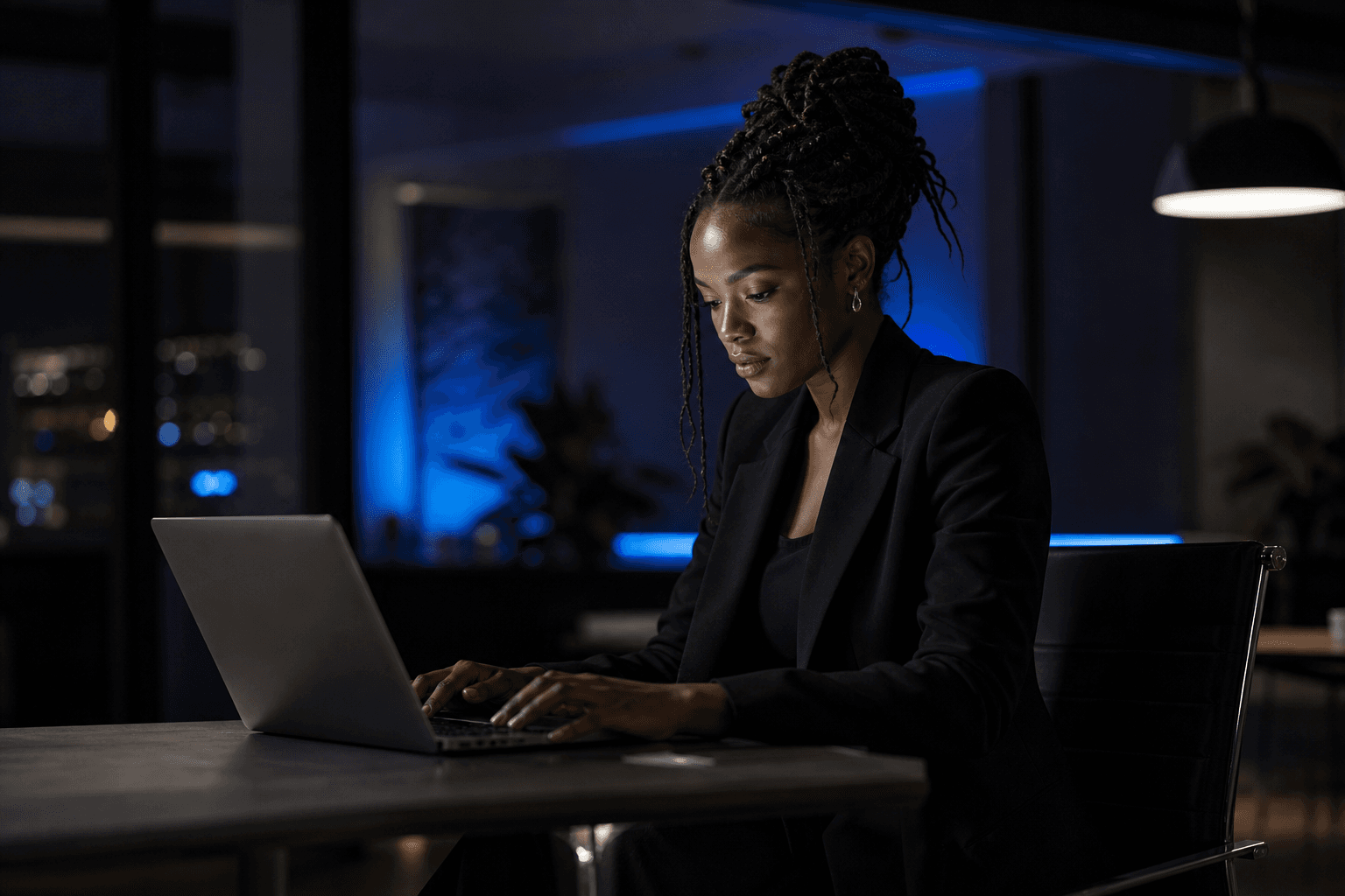 Professional working on laptop in a modern studio